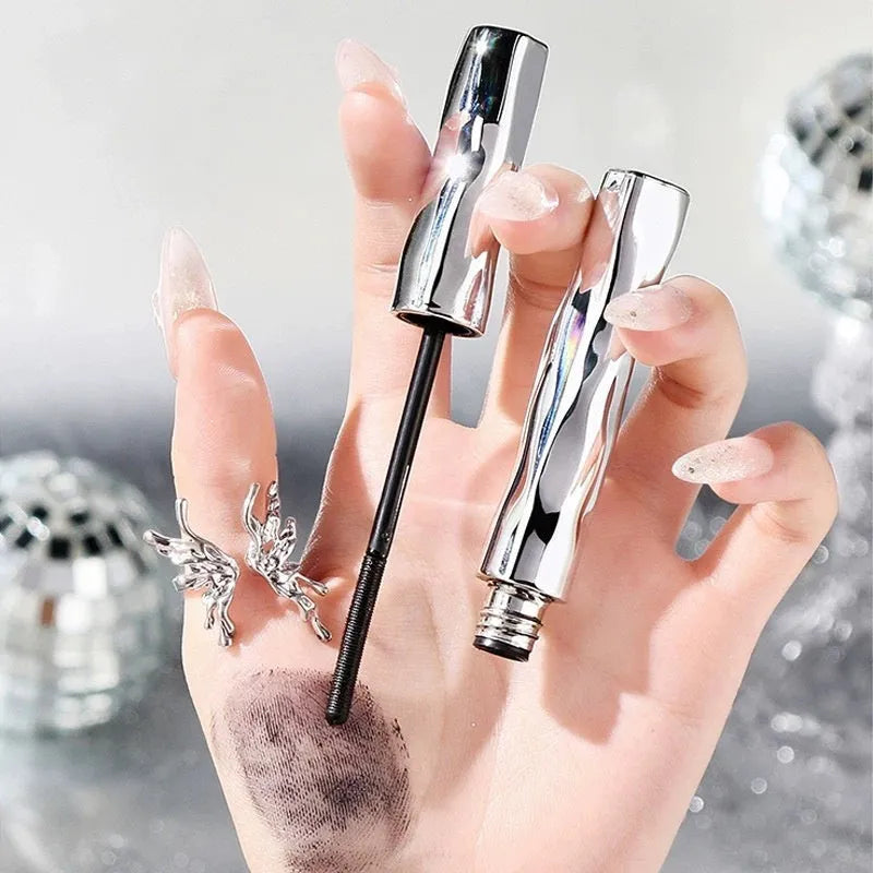 Waterproof steel tube mascara and eyelash curler in black and brown shades.