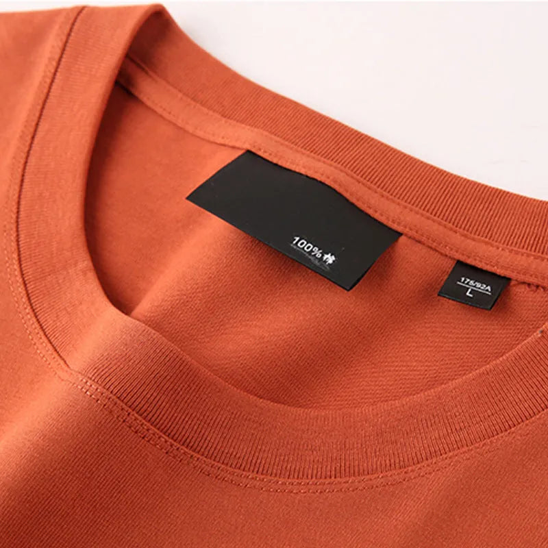 Loose fit men's cotton t-shirt with round neck and drop-shoulder sleeves in solid colour