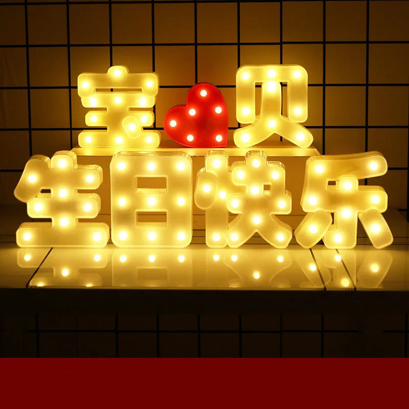 Plastic LED letter light decoration spelling a message, 22cm in height.