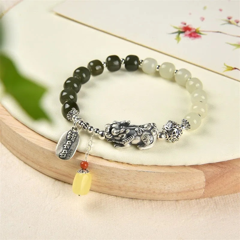 Retro women's pure silver bracelet with a Natural Hetian Jade stone and an 8mm coin charm.