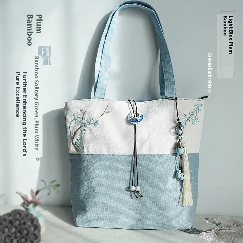 Artistic retro canvas shoulder handbag with hand-painted literary design and copper zipper
