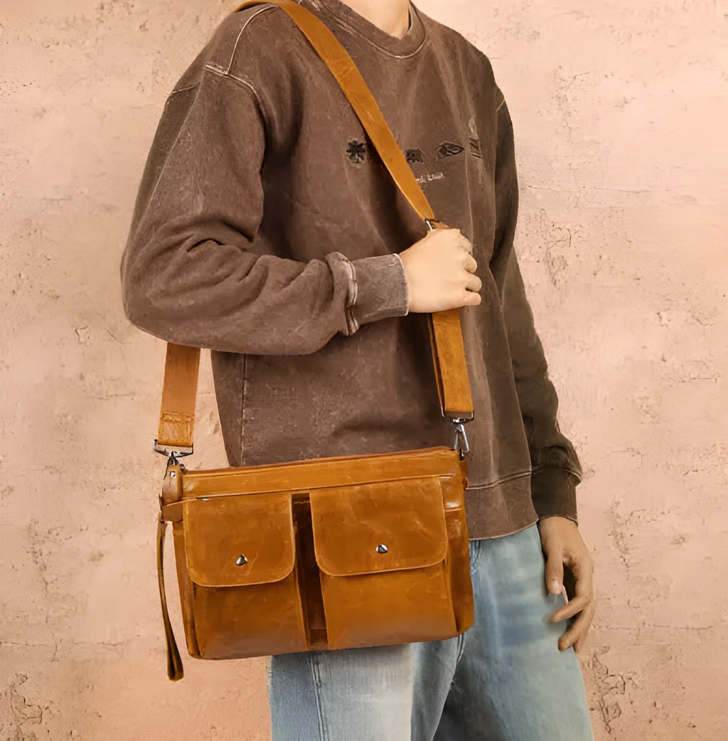 Men's genuine leather crossbody messenger bag in black solid colour on white background