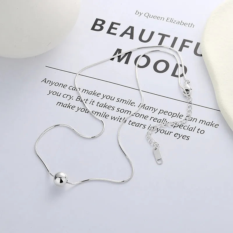 Small spherical pendant silver clavicle chain necklace with round elements and 925 sterling silver construction