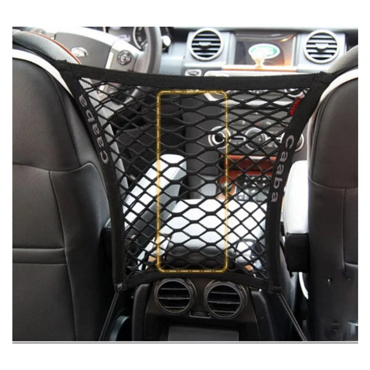 Black elastic nylon car pet fence isolation net installed on middle seat with hooks.