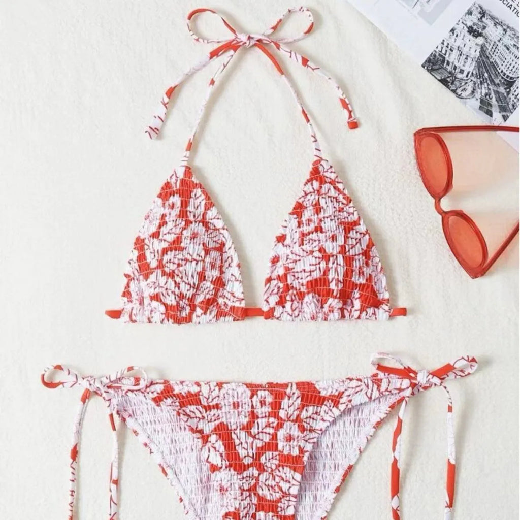 Women's floral halter swimsuit in polyester fabric showing pink colour option with brief-style bottoms