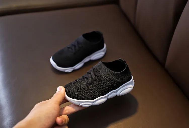 Children's fabric slip-on shoes with non-slip rubber soles in white, black, pink or grey colours