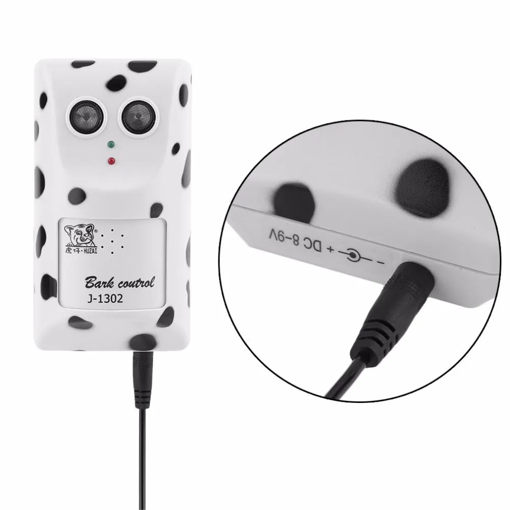 White anti-barking ultrasonic dog repeller mounted on a wall with rotary holder, 7x13x5cm