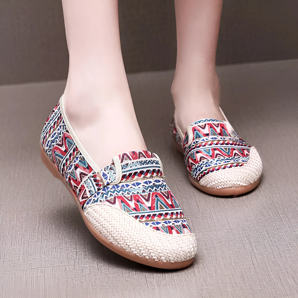 Women's flat heel ethnic cloth shoes in red, green, black, beige, or blue with colour stitching and a shallow mouth.
