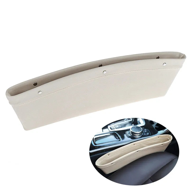 Faux leather car seat gap organiser in black holding phone, keys, and bills, fitted between car seat and centre console.