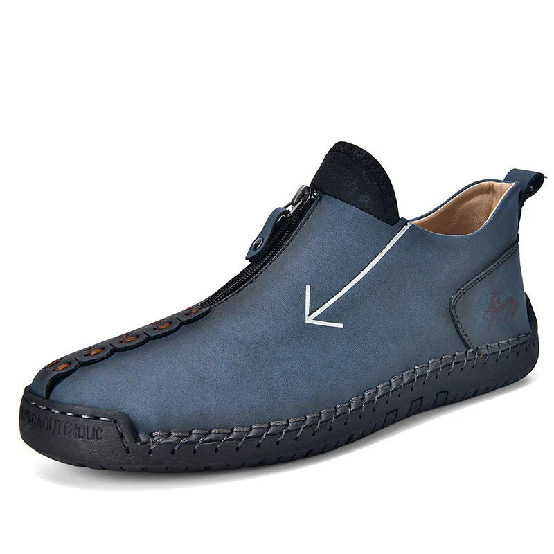 Men's black leather martin boots with a front zip, round toe, and hand-stitched seams on a rubber sole.