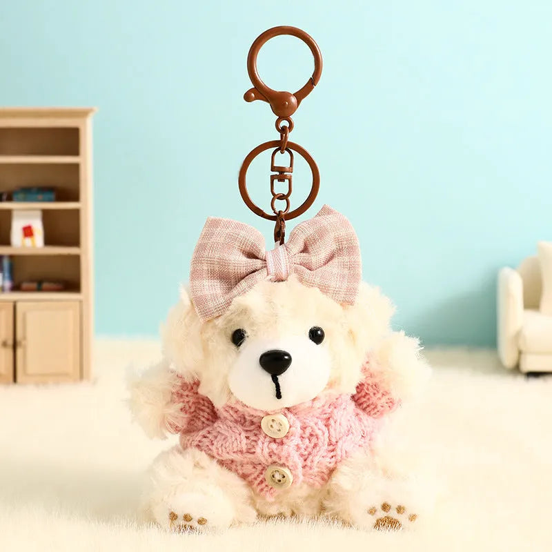 Plush biscuit bear keychain pendant with a red bow on a metal keyring