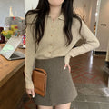 Loose fit long sleeve viscose knitted cardigan in beige, shown worn open.