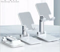 Black silicone and ABS plastic desk mobile phone holder on a wooden table.