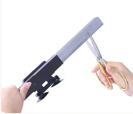 Car sun visor with aluminised film surface measuring 46cm clipped onto vehicle window