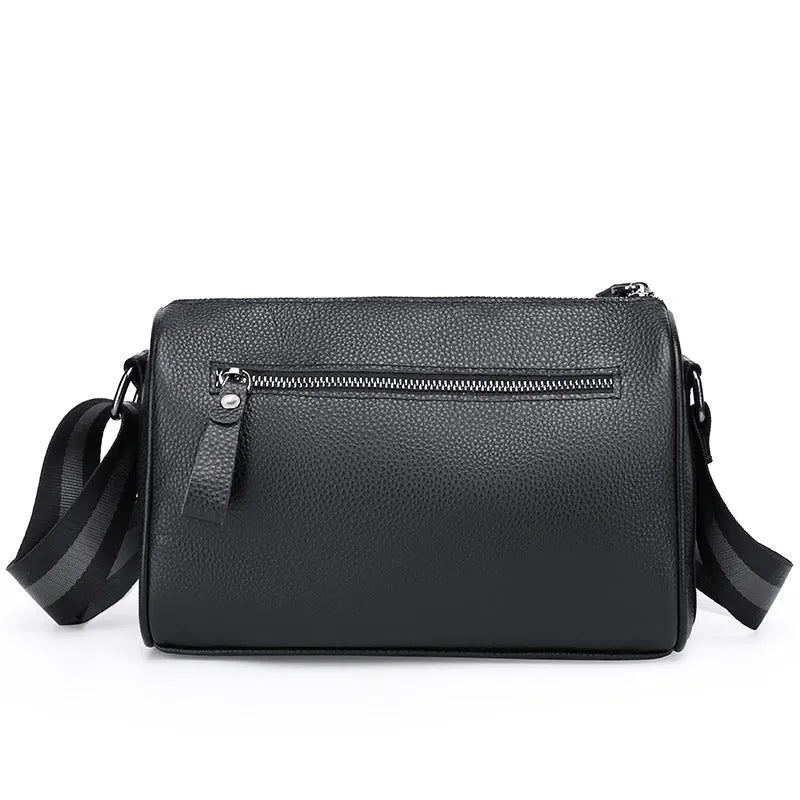 Black genuine leather crossbody bag showing adjustable strap and main compartment