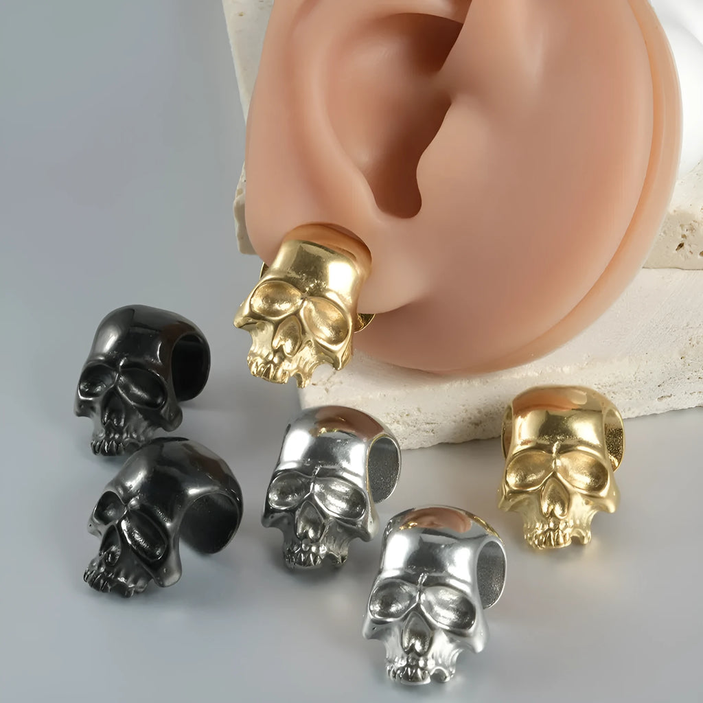 Stainless steel hollow skull Buddha earring in a geometry shape, shown in one of four colour options.
