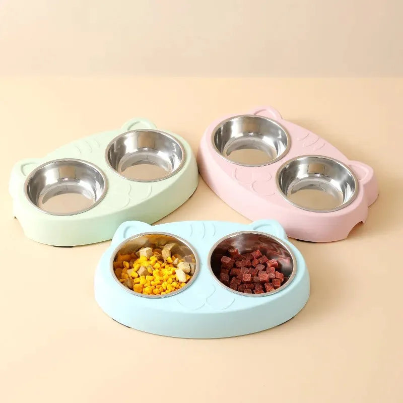 Blue macaron-shaped plastic pet feeder tray with two bowls for cat or dog food and water.