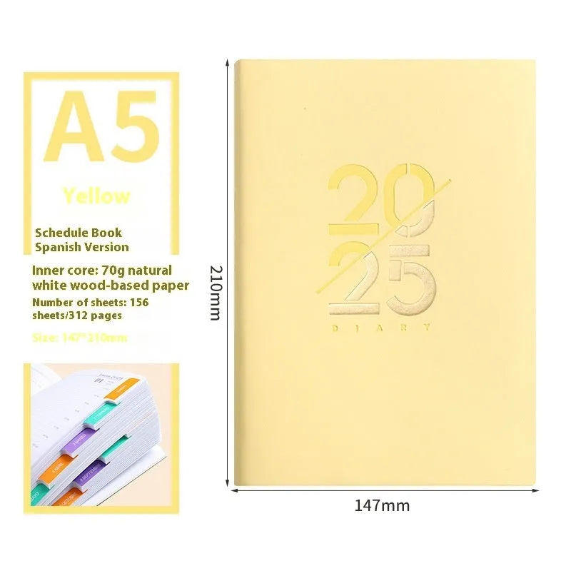 A5 daily planner notebook with soft faux leather cover in blue, lying open on a table.