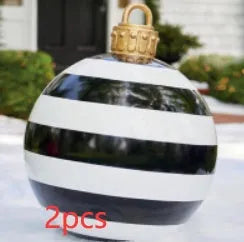 Large red and white striped inflatable Christmas ball ornament hanging on an outdoor tree