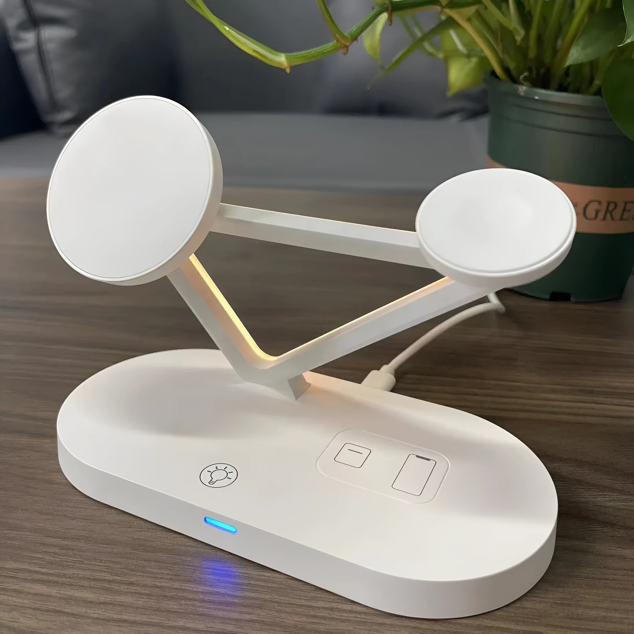 Black 3-in-1 wireless charging station showing phone, Apple Watch and AirPods charging simultaneously.