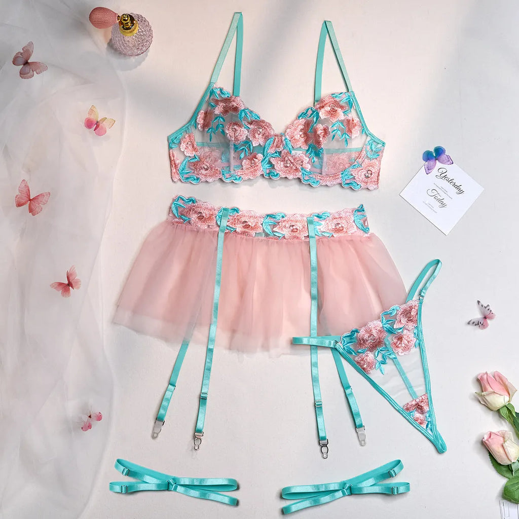 Pink women's mesh pettiskirt suit with matching embroidered bikini set on polyester fabric