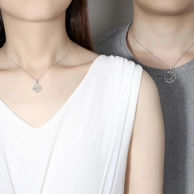 Sun moon tooth couple necklace with copper pendant on a cross chain, showing male and female colour variants.