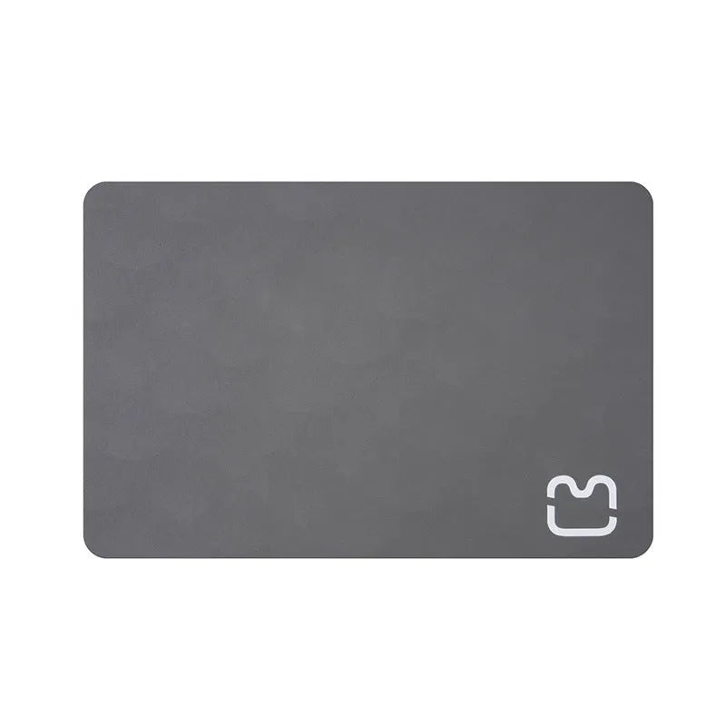 Minimalist pet feeding mat in cat head light gray, water-absorbent non-slip design for cat and dog bowls