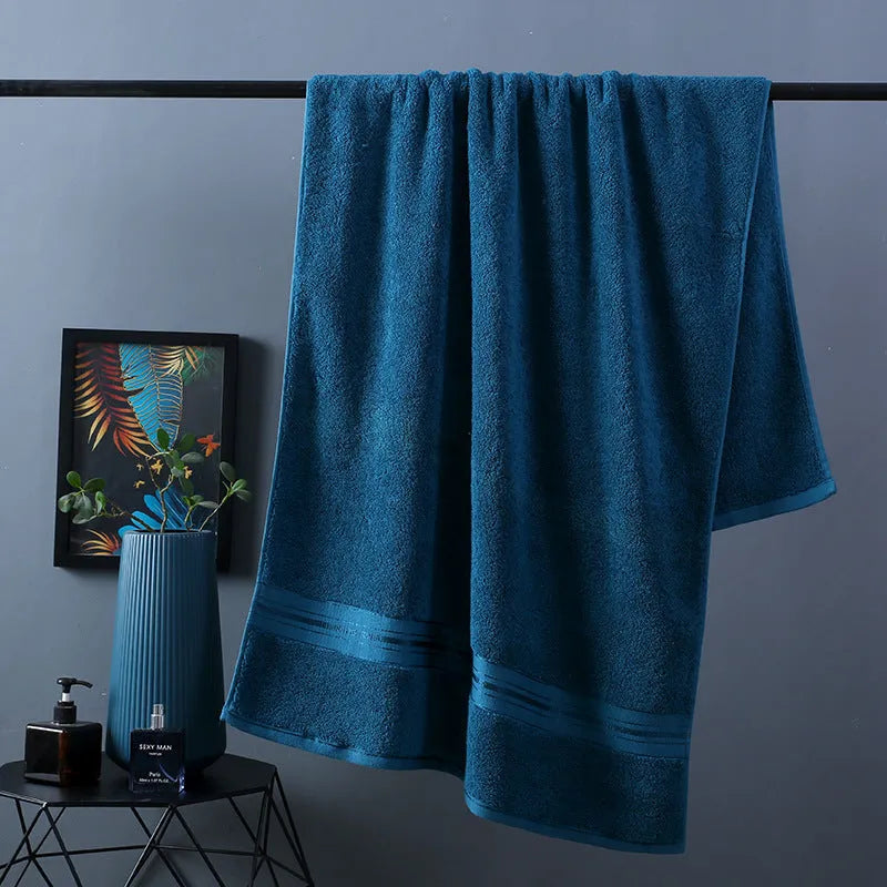 Three-piece cotton bath towel set in floral colours showing bath towel, hand towel and face cloth with optional logo printing