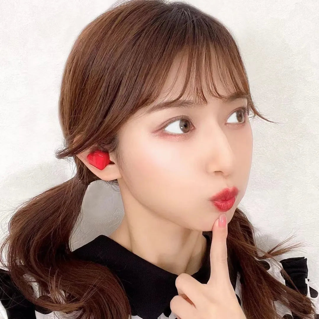 Heart-shaped wireless Bluetooth headphones in red and pink colour options with charging cable