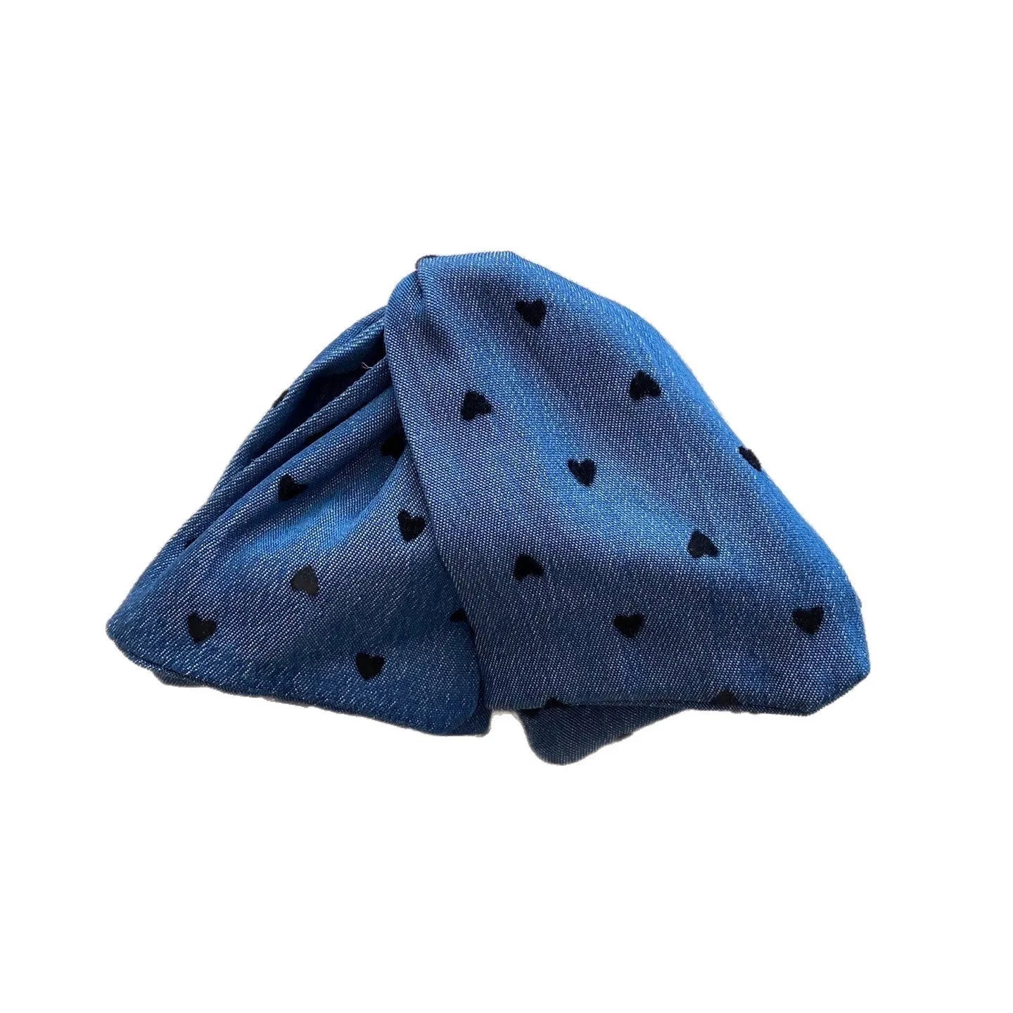 Handmade denim fabric and acrylic hair bow with triangle grip detail on plastic hairpin.