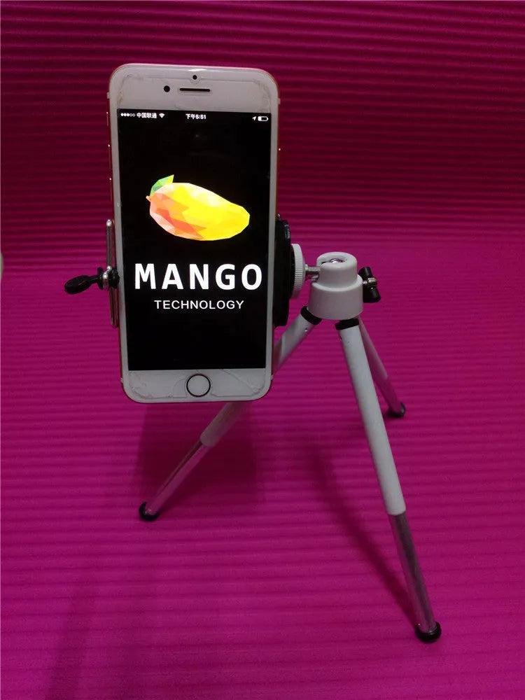 Black desktop phone holder with two-section adjustable bracket on wooden desk