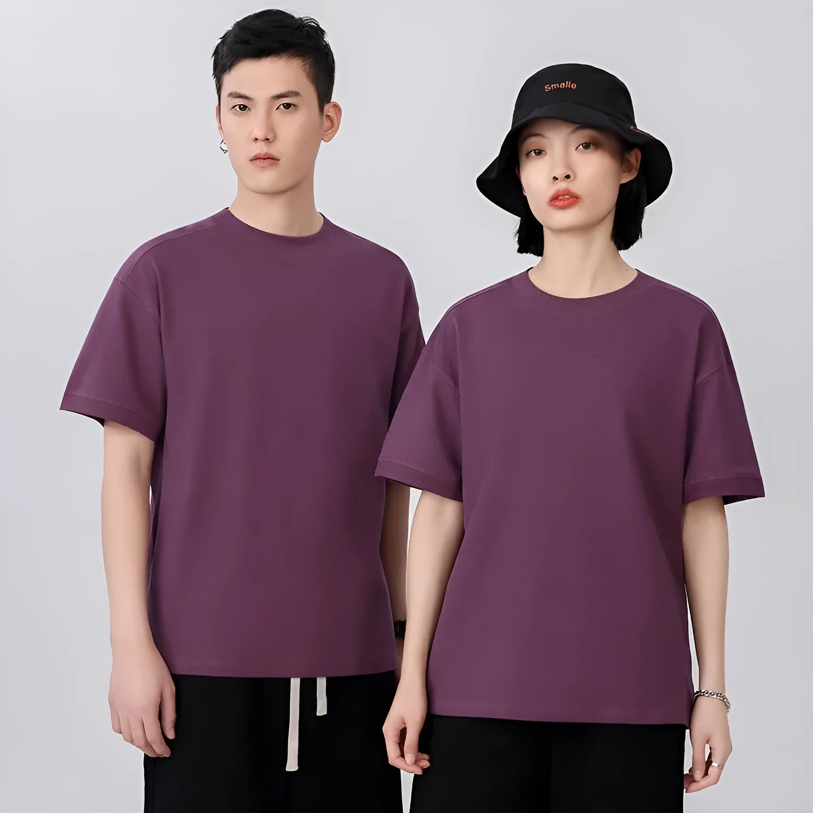 Men's loose grey cotton short-sleeved t-shirt on a hanger, casual summer wear.