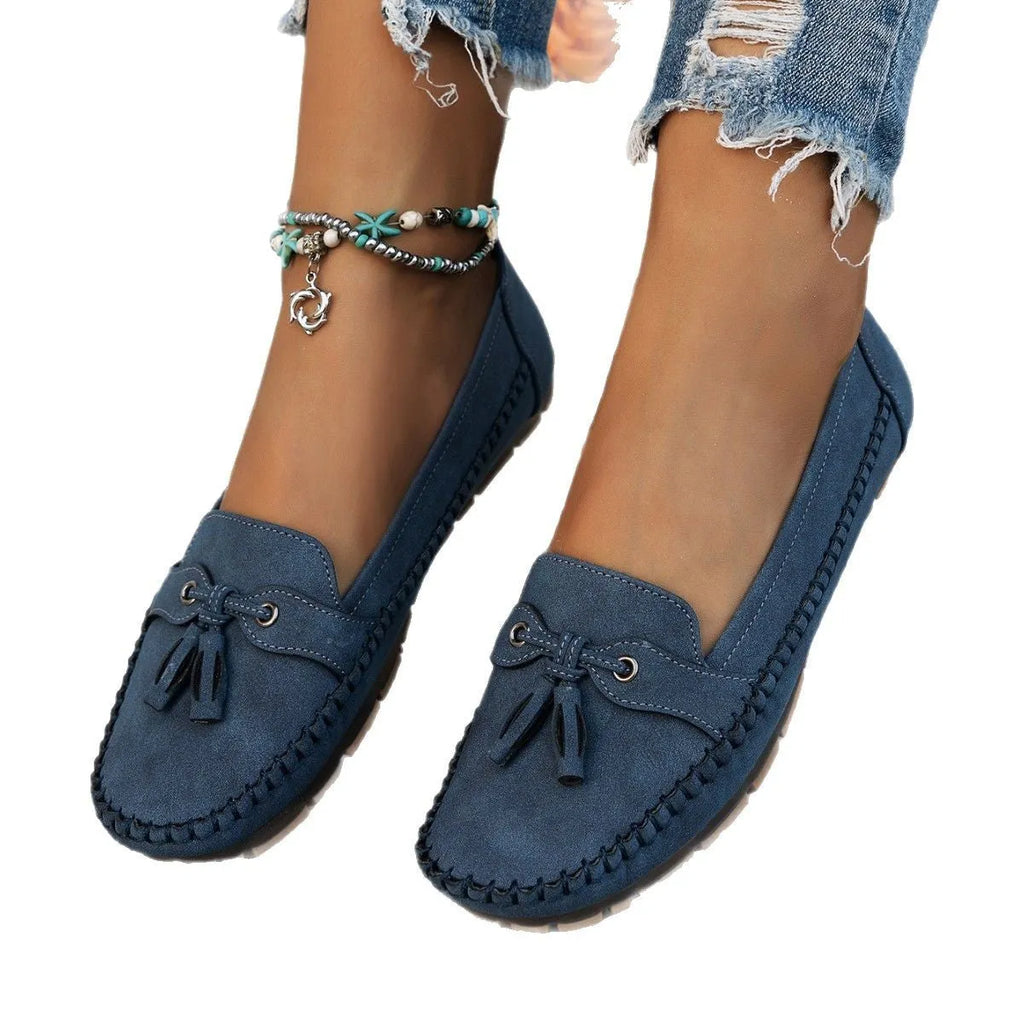 Women's casual flat shoes with bow detail in suede, shown in a solid colour.