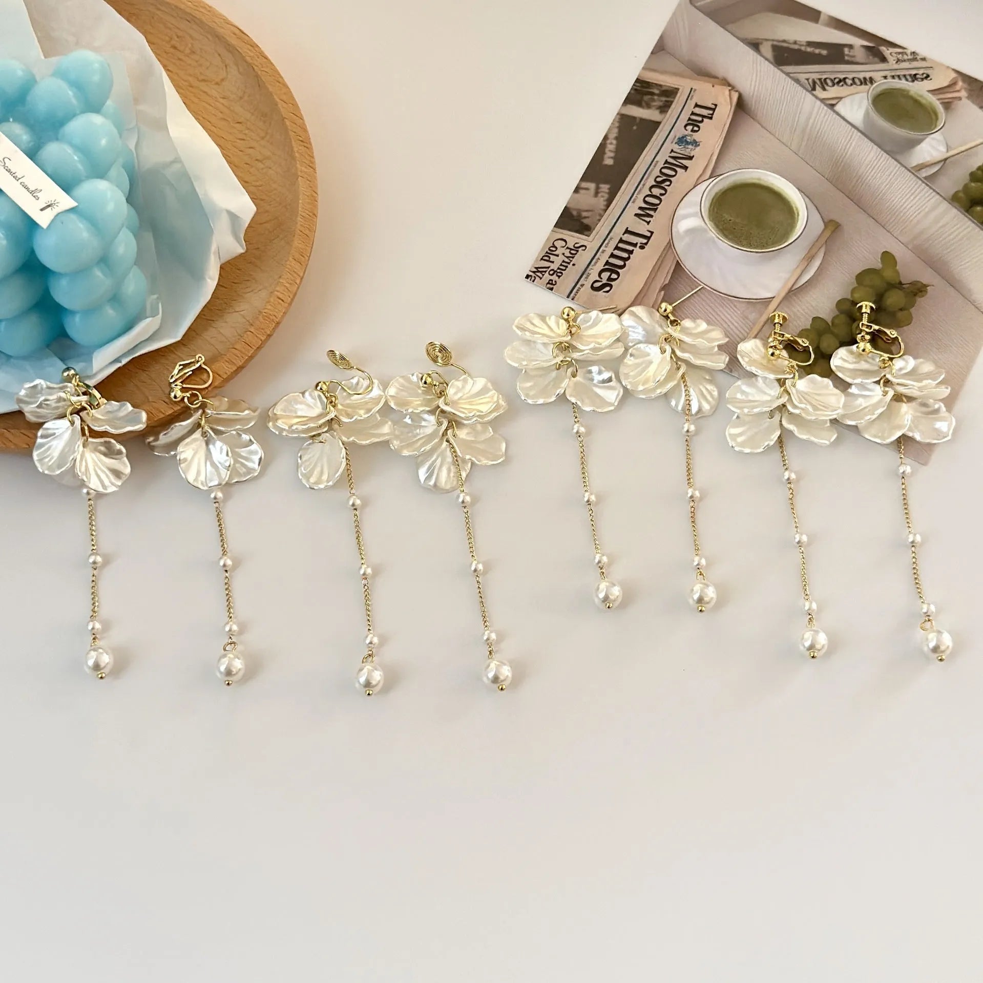 Women's acrylic shell pearl tassel clip earrings with four clip options showing 8.8cm length