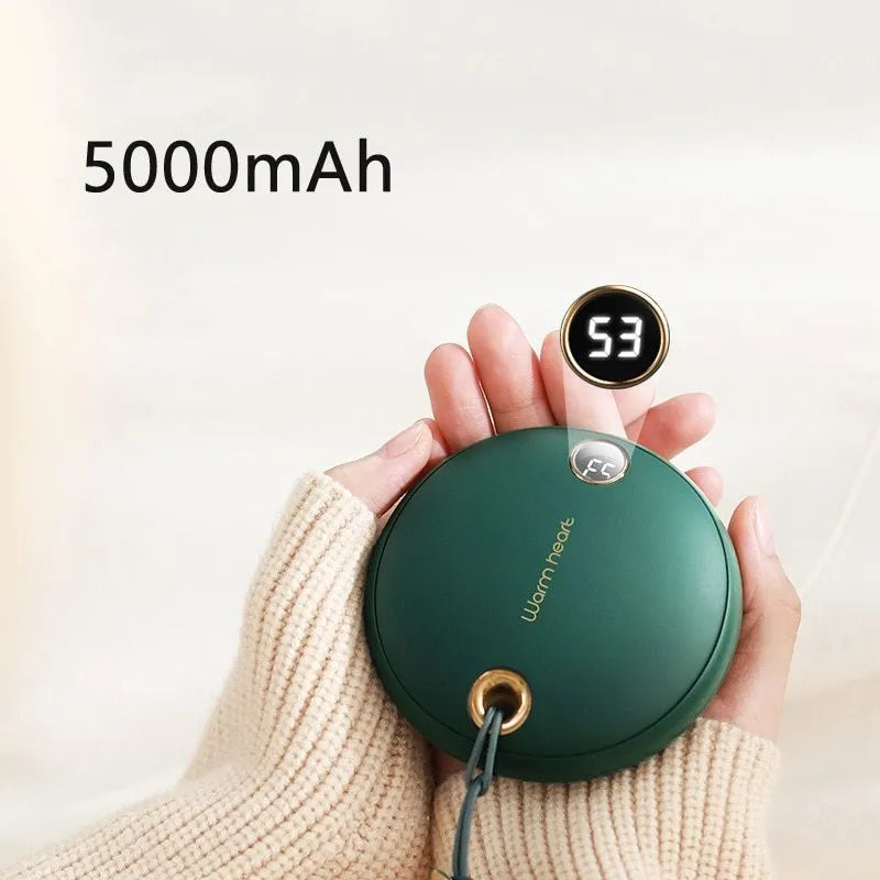 Green, pink or white 5000mAh power bank with digital display and integrated hand warmer function.