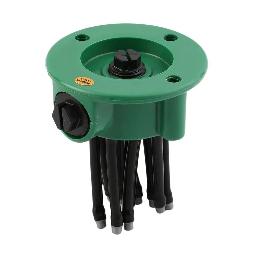 Green plastic adjustable lawn sprinkler with multiple bendable spray arms on a 9cm base.