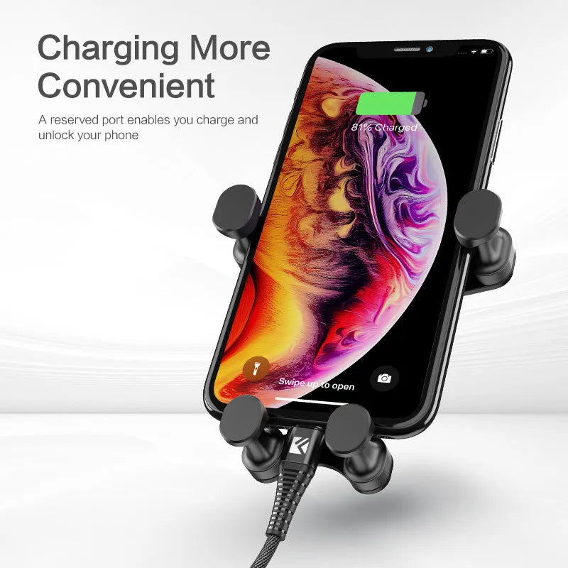 Black car phone holder with 360-degree rotation mounted on vehicle dashboard