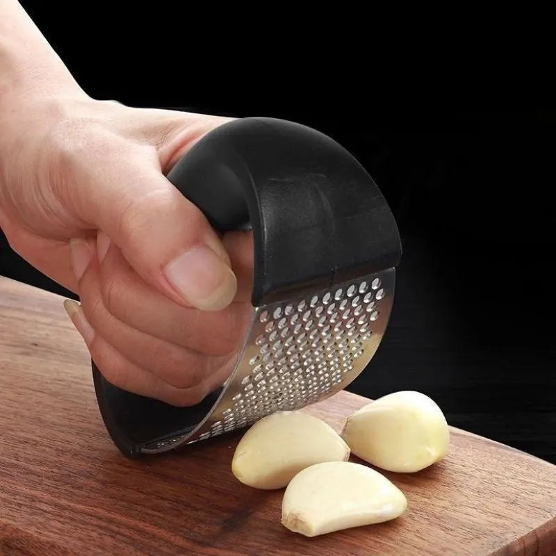 Stainless steel garlic masher press with ergonomic handle and non-slip grip