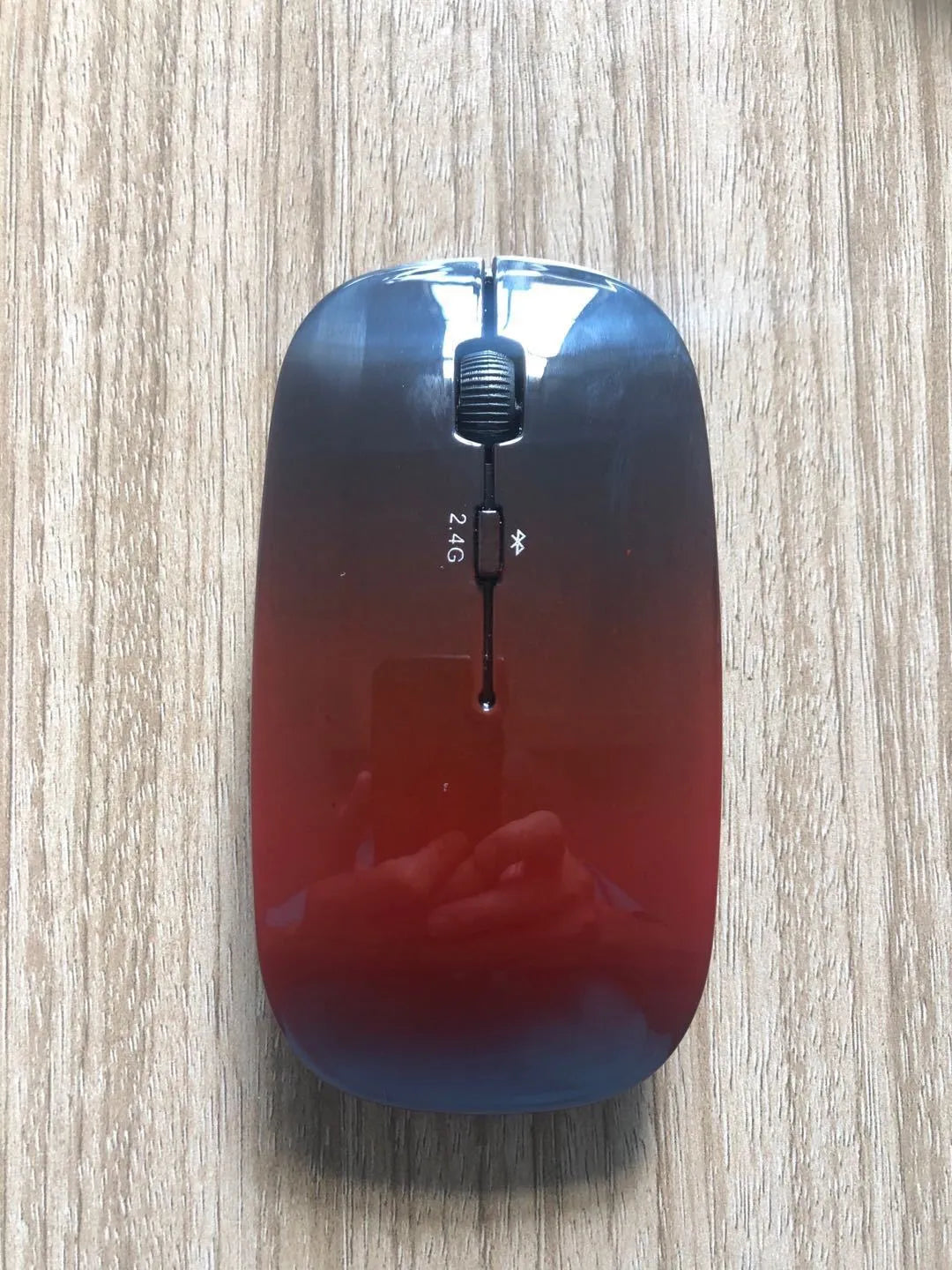 Wireless Bluetooth dual mode mouse in black with three buttons and four-way roller