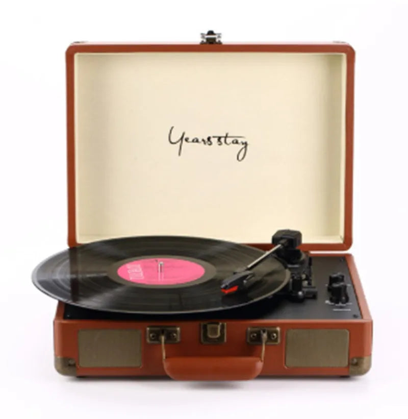 Leather-cased portable Bluetooth turntable for vinyl and film records in multiple colours.