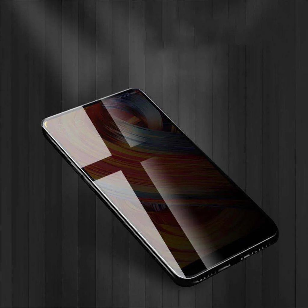 Black ceramic matte anti-peep screen protector for iPhone on a phone screen.