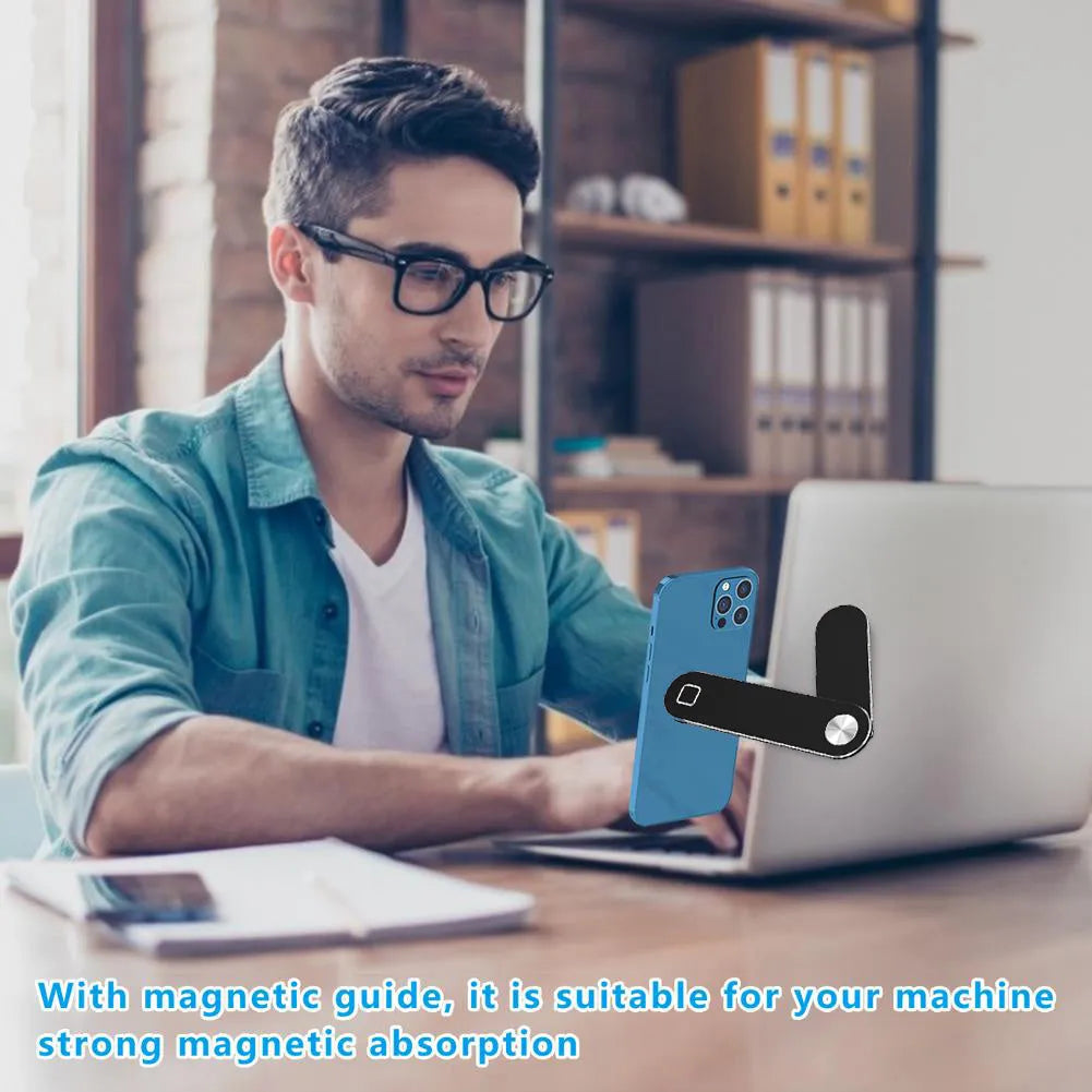 Black aluminium laptop phone holder with magnetic clip mounted to side of monitor