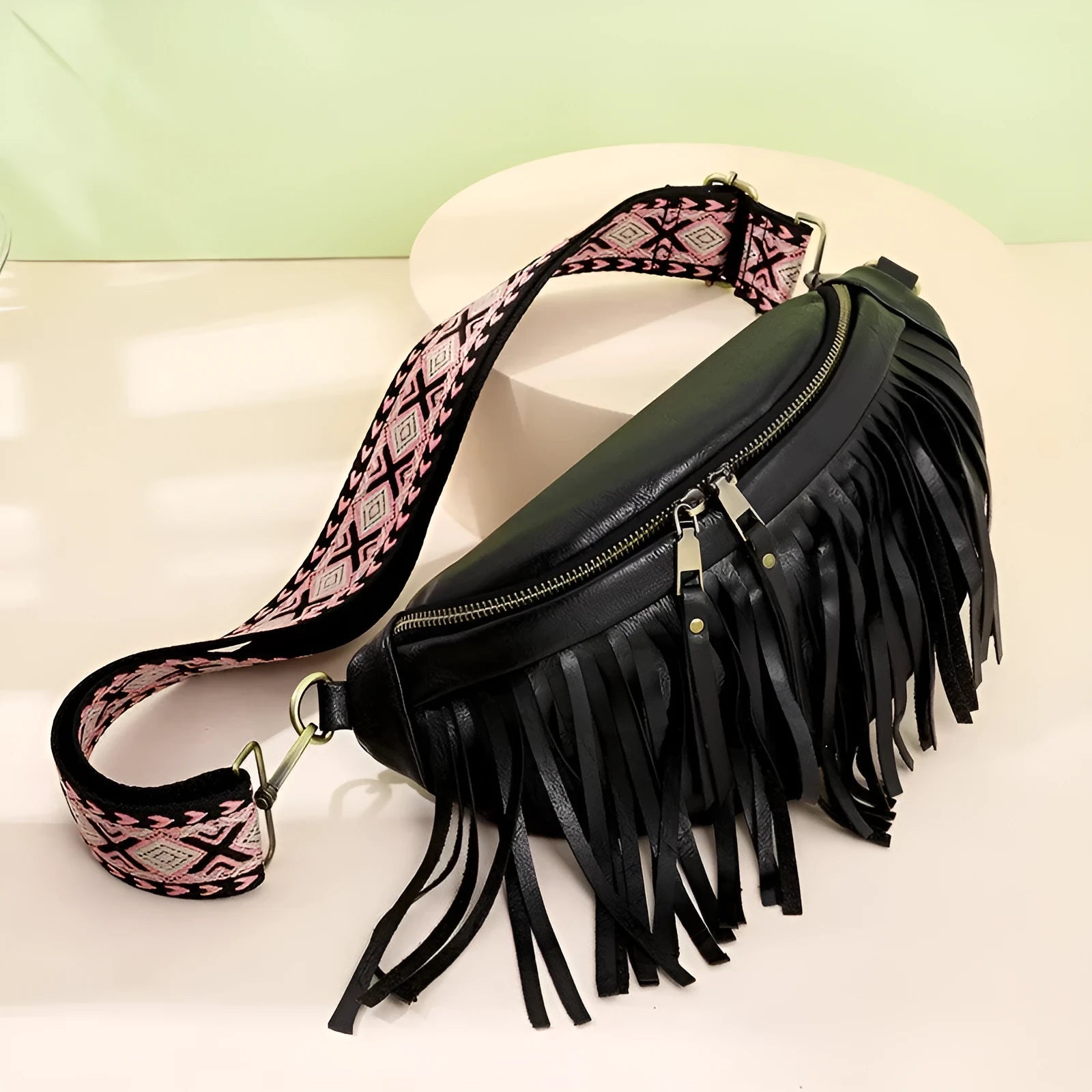 Retro-style pleated messenger crossbody bag in PU leather with a tassel, shown in macaron-gray.