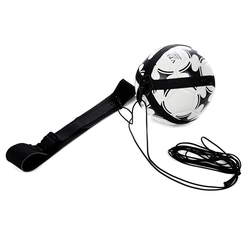 Black soccer training tether with adjustable waist belt and elastic Velcro strap on a green grass field