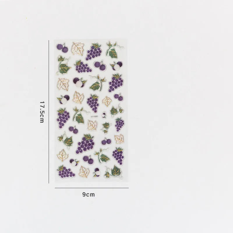 Sheet of six DIY fruit bronzing stickers showing grape, orange, passion fruit, peach, pineapple and strawberry designs.