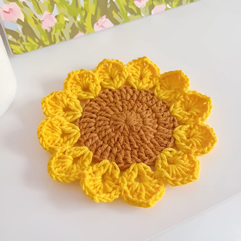 Hand-woven wool flower coasters showing floral pattern texture and natural wool material