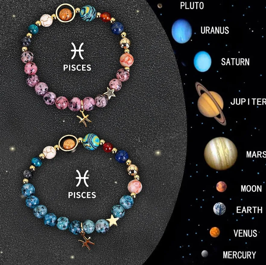 Two natural stone beaded bracelets with zodiac charms on a table.