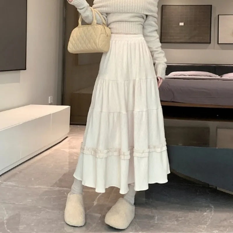 Korean style A-line corduroy skirt with elastic waistband in beige colour showing midi length
