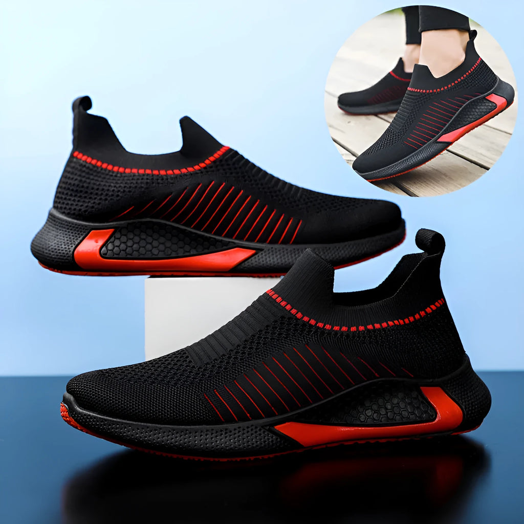 Men's black and white striped slip-on sneakers with lace-up front and mesh design.