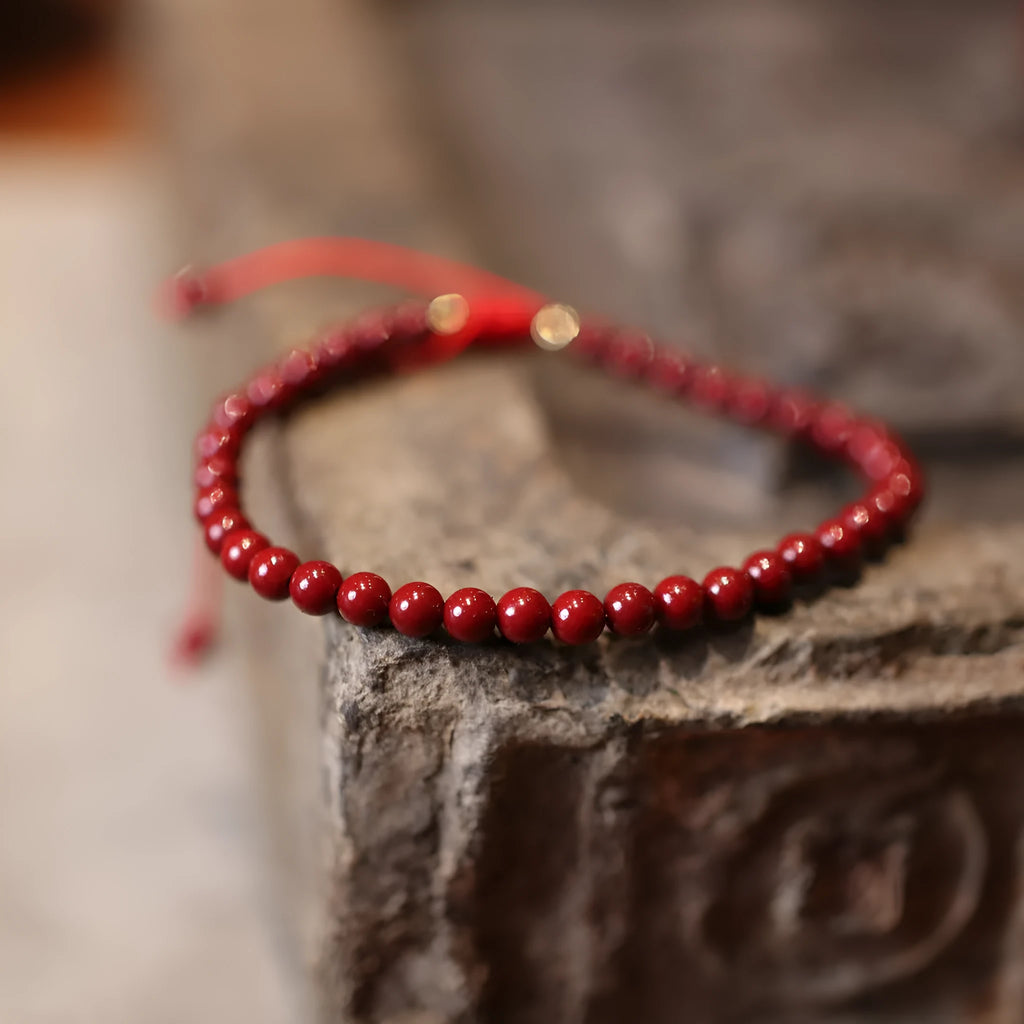 Natural cinnabar bracelet with purple gold sand design and geometric shape featuring auspicious patterns